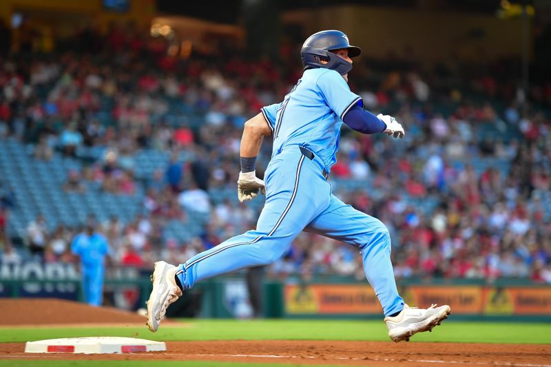 Aug 13, 2024; Anaheim, California, USA; Toronto Blue Jays second baseman Will Wagner (7) runs after hitting a double against the Los Angeles Angels during the third inning at Angel Stadium. Mandatory Credit: Gary A. Vasquez-USA TODAY Sports