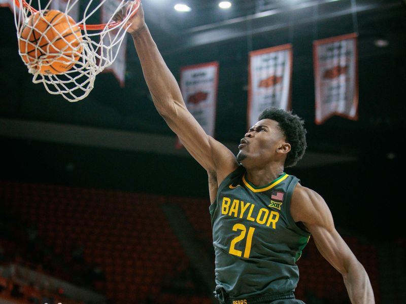 Jan 6, 2024; Stillwater, Oklahoma, USA; Baylor Bears center Yves Missi (21) dunks during the second half against the Oklahoma State Cowboys at Gallagher-Iba Arena. Mandatory Credit: William Purnell-USA TODAY Sports