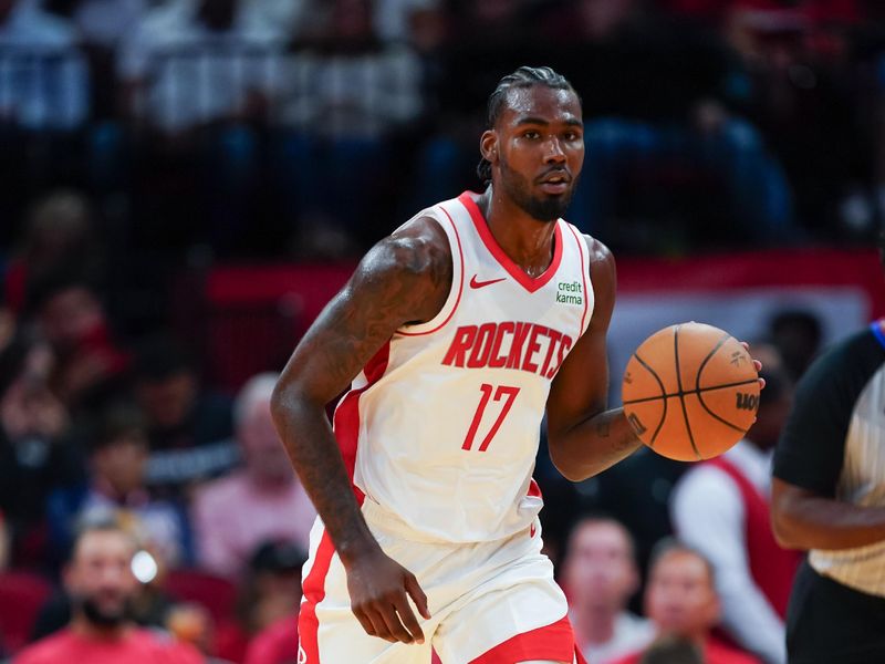 HOUSTON, TEXAS - OCTOBER 10: Tari Eason #17 of the Houston Rockets dribbles the ball during the preseason game against the Indiana Pacers at Toyota Center on October 10, 2023 in Houston, Texas. NOTE TO USER: User expressly acknowledges and agrees that, by downloading and or using this photograph, User is consenting to the terms and conditions of the Getty Images License Agreement. (Photo by Alex Bierens de Haan/Getty Images)