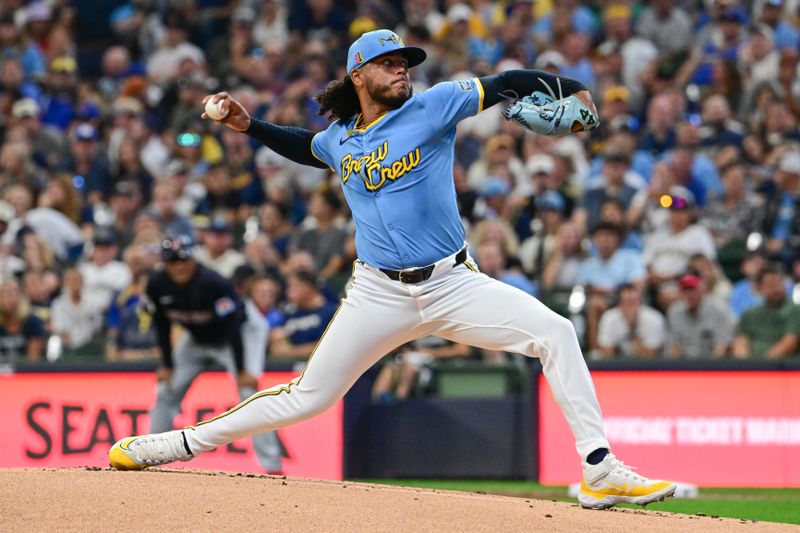 Aug 17, 2024; Milwaukee, Wisconsin, USA; Milwaukee Brewers starting pitcher Freddy Peralta (51) pitches against the Cleveland Guardians in the first inning at American Family Field. Mandatory Credit: Benny Sieu-USA TODAY Sports