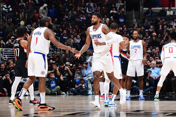 LOS ANGELES, CA - DECEMBER 11: James Harden #1 high fives Paul George #13 of the LA Clippers during the game against the Portland Trail Blazers on December 11, 2023 at Crypto.Com Arena in Los Angeles, California. NOTE TO USER: User expressly acknowledges and agrees that, by downloading and/or using this Photograph, user is consenting to the terms and conditions of the Getty Images License Agreement. Mandatory Copyright Notice: Copyright 2023 NBAE (Photo by Adam Pantozzi/NBAE via Getty Images)