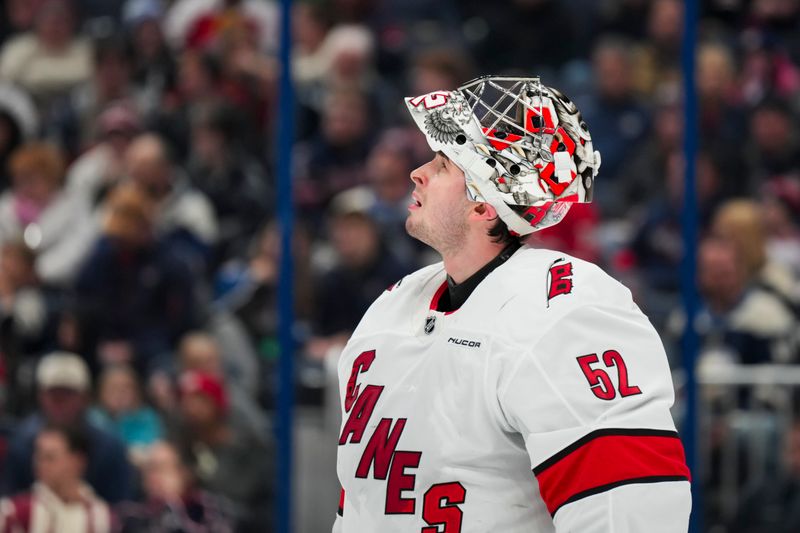 Nov 23, 2024; Columbus, Ohio, USA;  Carolina Hurricanes goaltender Pyotr Kochetkov (52) skates to the bench during a stop in play against the Columbus Blue Jackets in the second period at Nationwide Arena. Mandatory Credit: Aaron Doster-Imagn Images