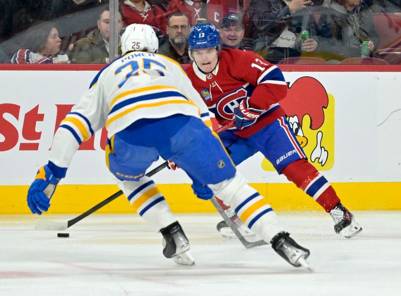 Mar 3, 2025; Montreal, Quebec, CAN; Montreal Canadiens forward Cole Caufield (13) plays the puck and Buffalo Sabres defenseman Owen Power (25) defends during the second period at the Bell Centre. Mandatory Credit: Eric Bolte-Imagn Images