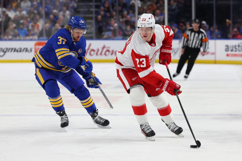 Dec 5, 2023; Buffalo, New York, USA;  Detroit Red Wings left wing Lucas Raymond (23) looks to make a pass during the first period against the Buffalo Sabres at KeyBank Center. Mandatory Credit: Timothy T. Ludwig-USA TODAY Sports