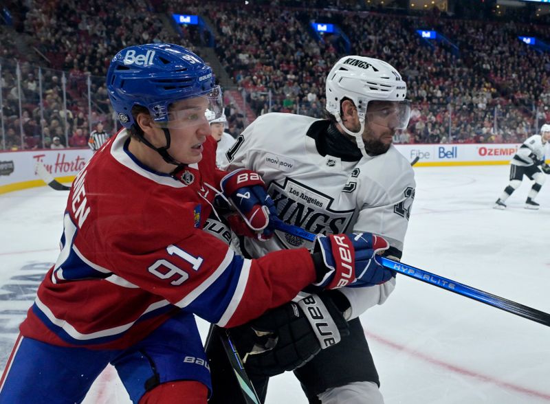 Oct 17, 2024; Montreal, Quebec, CAN; Montreal Canadiens forward Oliver Kapanen (91) and Los Angeles Kings forward Anze Kopitar (11) during the second period at the Bell Centre. Mandatory Credit: Eric Bolte-Imagn Images