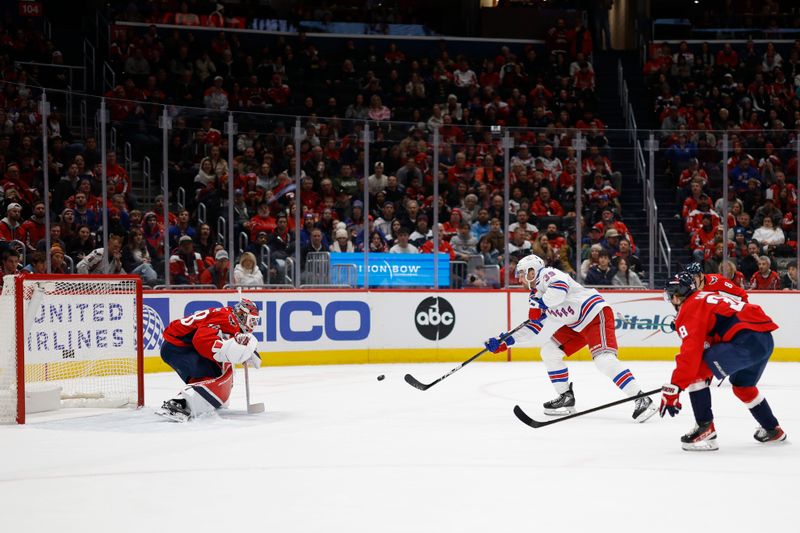 Jan 4, 2025; Washington, District of Columbia, USA;New York Rangers center Sam Carrick (39) scores a goal on Washington Capitals goaltender Logan Thompson (48) in the second period at Capital One Arena. Mandatory Credit: Geoff Burke-Imagn Images