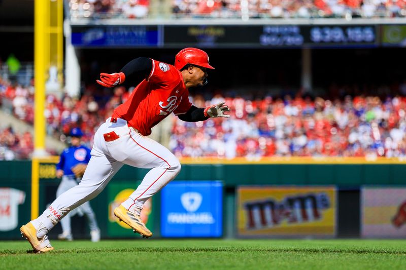May 24, 2025; Cincinnati, Ohio, USA; Cincinnati Reds third baseman Santiago Espinal (4) runs to first after hitting a single in the fifth inning against the Chicago Cubs at Great American Ball Park. Mandatory Credit: Katie Stratman-Imagn Images