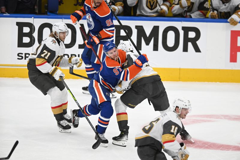 May 10, 2025; Edmonton, Alberta, CAN; Edmonton Oilers centre Connor McDavid (97) collides with Las Vegas Golden Knights Defencmena Zach Whirtecloud (2) during the first period in game three of the second round of the 2025 Stanley Cup Playoffs at Rogers Place. Mandatory Credit: Walter Tychnowicz-Imagn Images