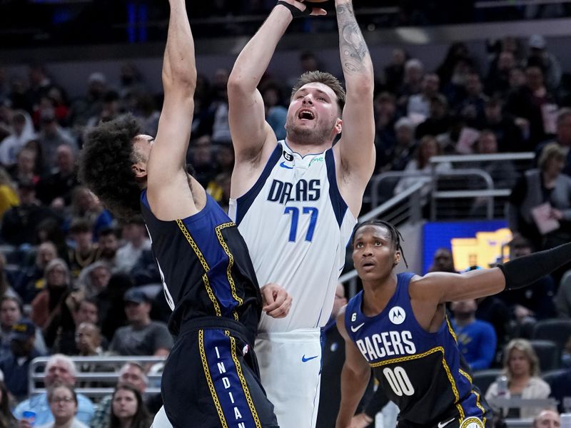INDIANAPOLIS, INDIANA - MARCH 27: Luka Doncic #77 of the Dallas Mavericks attempts a shot while being guarded by Jordan Nwora #13 of the Indiana Pacers in the second quarter at Gainbridge Fieldhouse on March 27, 2023 in Indianapolis, Indiana. NOTE TO USER: User expressly acknowledges and agrees that, by downloading and or using this photograph, User is consenting to the terms and conditions of the Getty Images License Agreement. (Photo by Dylan Buell/Getty Images)