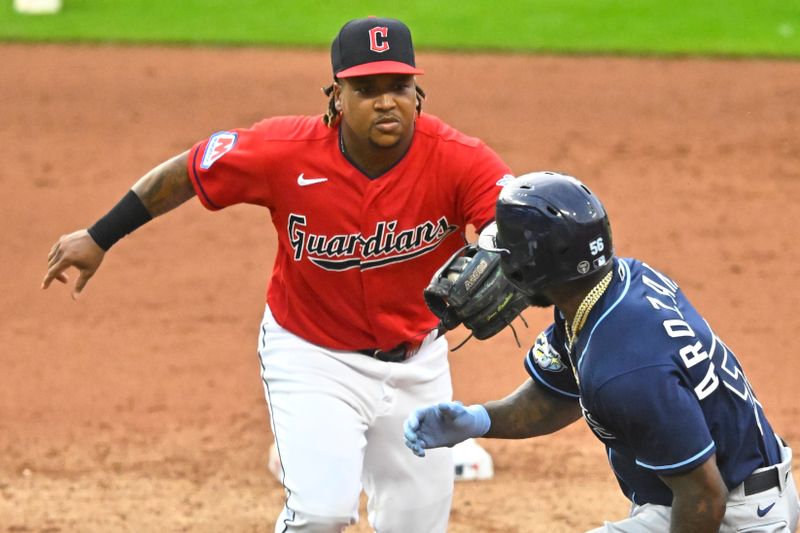 Sep 2, 2023; Cleveland, Ohio, USA; Cleveland Guardians third baseman Jose Ramirez (11) tags out Tampa Bay Rays left fielder Randy Arozarena (56) in the fifth inning at Progressive Field. Mandatory Credit: David Richard-USA TODAY Sports