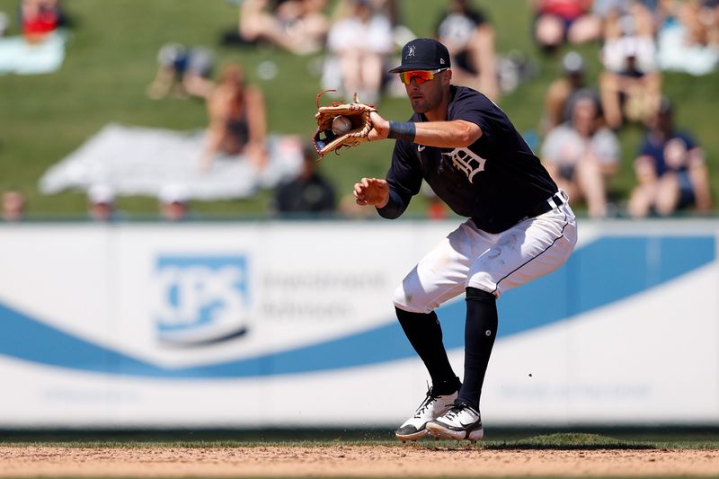 Mar 21, 2022; Lakeland, Florida, USA; Detroit Tigers shortstop Ryan Kreidler (72) fields the ball in the fifth inning against the Toronto Blue Jays during spring training at Publix Field at Joker Marchant Stadium. Mandatory Credit: Nathan Ray Seebeck-USA TODAY Sports