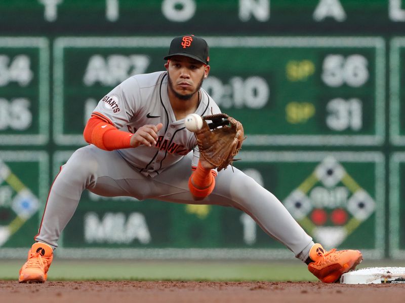 May 22, 2024; Pittsburgh, Pennsylvania, USA;  San Francisco Giants second baseman Thairo Estrada (39) takes a throw at second base to record an out against the Pittsburgh Pirates during the third inning at PNC Park. Mandatory Credit: Charles LeClaire-USA TODAY Sports