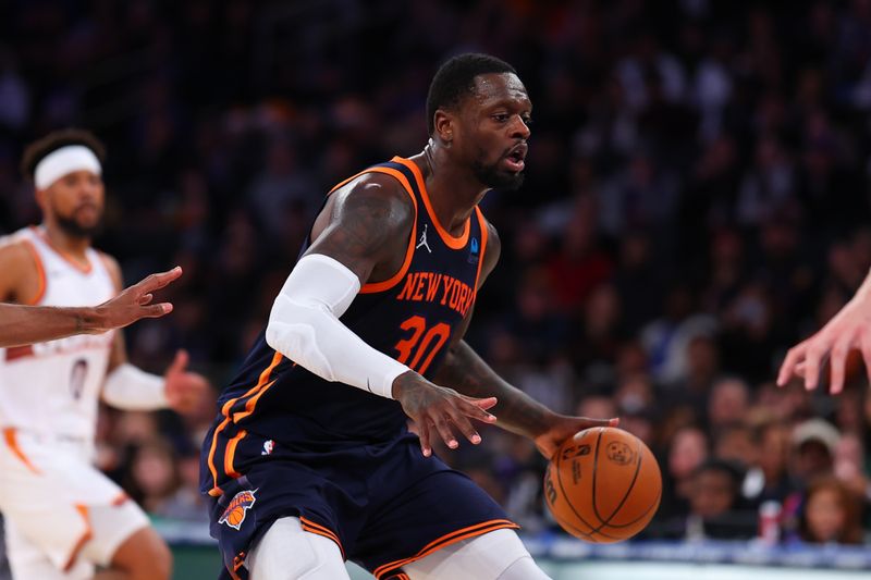 NEW YORK, NY - NOVEMBER 26: Julius Randle #30 of the New York Knicks dribbles the ball during the fourth quarter of the game against the Phoenix Suns at Madison Square Garden on November 26, 2023 in New York City, New York. NOTE TO USER: User expressly acknowledges and agrees that, by downloading and or using this photograph, User is consenting to the terms and conditions of the Getty Images License Agreement. (Photo by Rich Graessle/Getty Images)