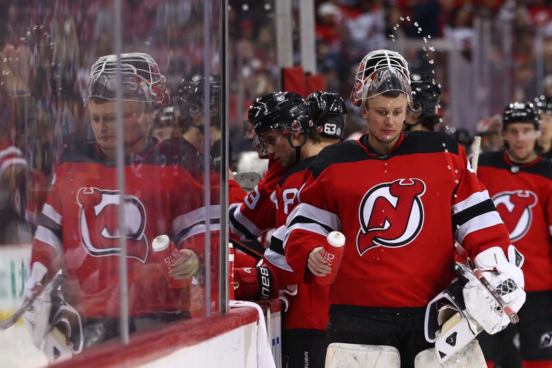 Jan 5, 2024; Newark, New Jersey, USA; New Jersey Devils goaltender Vitek Vanecek (41) squirts water during a break in the second period against the Chicago Blackhawks at Prudential Center. Mandatory Credit: Ed Mulholland-USA TODAY Sports