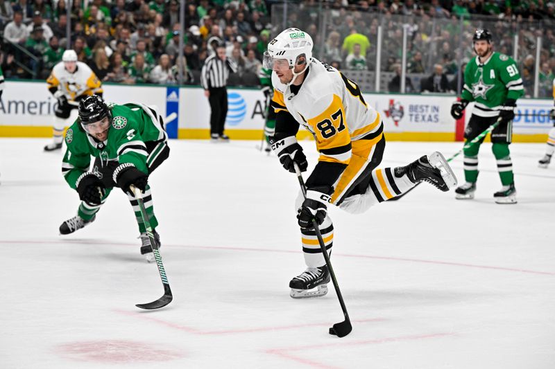 Mar 22, 2024; Dallas, Texas, USA; Pittsburgh Penguins center Sidney Crosby (87) skates past Dallas Stars defenseman Nils Lundkvist (5) during the first period at the American Airlines Center. Mandatory Credit: Jerome Miron-USA TODAY Sports