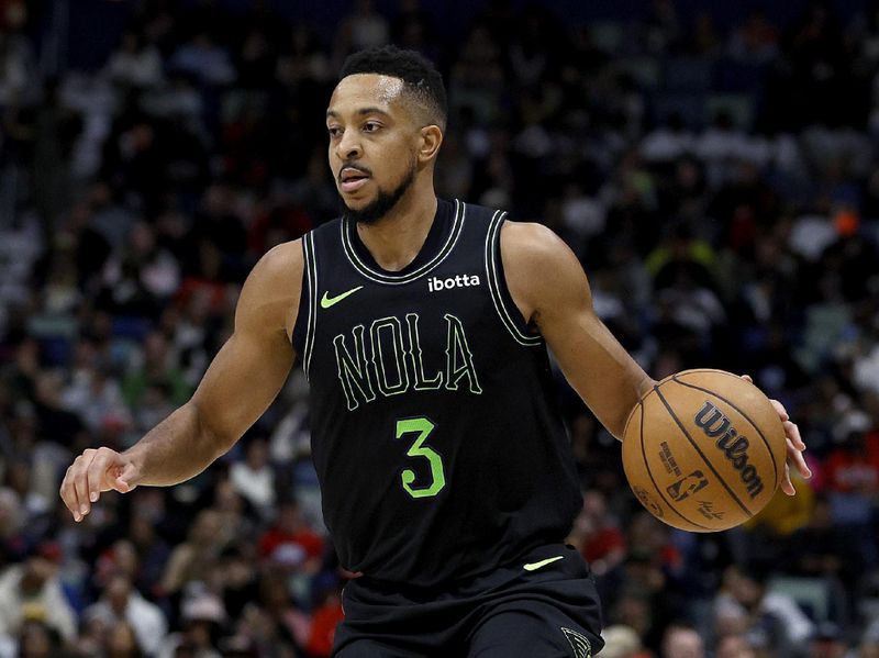 NEW ORLEANS, LOUISIANA - JANUARY 23: CJ McCollum #3 of the New Orleans Pelicans dribbles the ball down court during the third quarter of an NBA game against the Utah Jazz at Smoothie King Center on January 23, 2024 in New Orleans, Louisiana. NOTE TO USER: User expressly acknowledges and agrees that, by downloading and or using this photograph, User is consenting to the terms and conditions of the Getty Images License Agreement. (Photo by Sean Gardner/Getty Images)