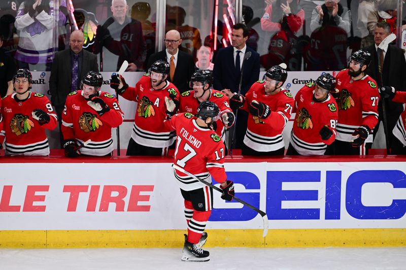 Nov 21, 2024; Chicago, Illinois, USA; Chicago Blackhawks left wing Nick Foligno (17) celebrates his empty net goal with teammates against the Florida Panthers during the third period at the United Center. Mandatory Credit: Daniel Bartel-Imagn Images