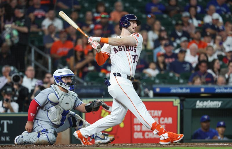 Apr 3, 2024; Houston, Texas, USA; Houston Astros right fielder Kyle Tucker (30) hits a single during the first inning against the Toronto Blue Jays at Minute Maid Park. Mandatory Credit: Troy Taormina-USA TODAY Sports