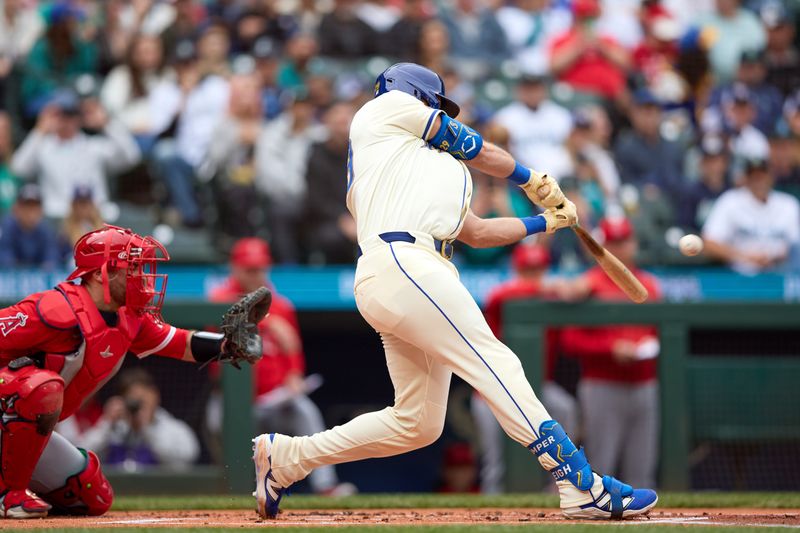 Sep 14, 2025; Seattle, Washington, USA;  Seattle Mariners catcher Cal Raleigh (29) hits a two-run home run in the inning against the Los Angeles Angels in the first inning at T-Mobile Park. Mandatory Credit: John Froschauer-Imagn Images