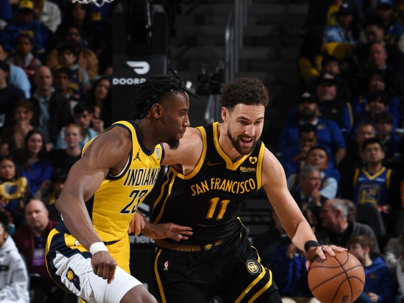 SAN FRANCISCO, CA - MARCH 22: Klay Thompson #11 of the Golden State Warriors dribbles the ball during the game against the Indiana Pacers on March 22, 2024 at Chase Center in San Francisco, California. NOTE TO USER: User expressly acknowledges and agrees that, by downloading and or using this photograph, user is consenting to the terms and conditions of Getty Images License Agreement. Mandatory Copyright Notice: Copyright 2024 NBAE (Photo by Noah Graham/NBAE via Getty Images)