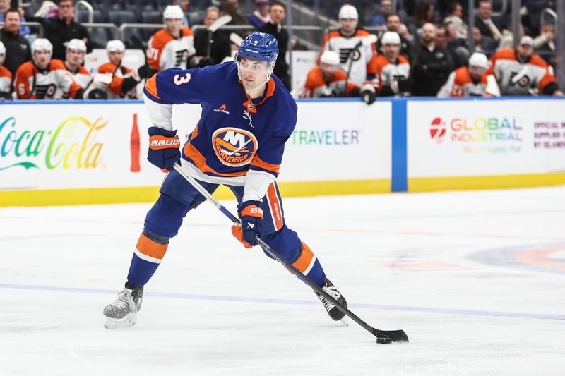 Jan 16, 2025; Elmont, New York, USA;  New York Islanders defenseman Adam Pelech (3) attempts a shot on goal in the second period against the Philadelphia Flyers at UBS Arena. Mandatory Credit: Wendell Cruz-Imagn Images