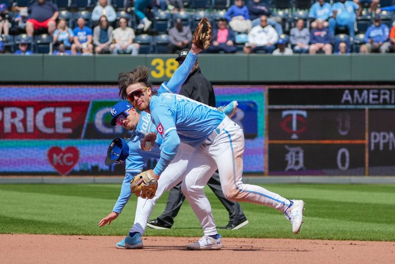 Apr 11, 2024; Kansas City, Missouri, USA; Kansas City Royals second base Nick Loftin (12) dives over shortstop Bobby Witt Jr. (7) going for a ground ball against the Houston Astros in the fourth inning at Kauffman Stadium. Mandatory Credit: Denny Medley-USA TODAY Sports