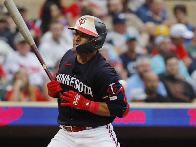 Sep 23, 2023; Minneapolis, Minnesota, USA; Minnesota Twins third baseman Donovan Solano (39) is hit by a pitch against the Los Angeles Angels in the eighth inning at Target Field. Mandatory Credit: Bruce Kluckhohn-USA TODAY Sports