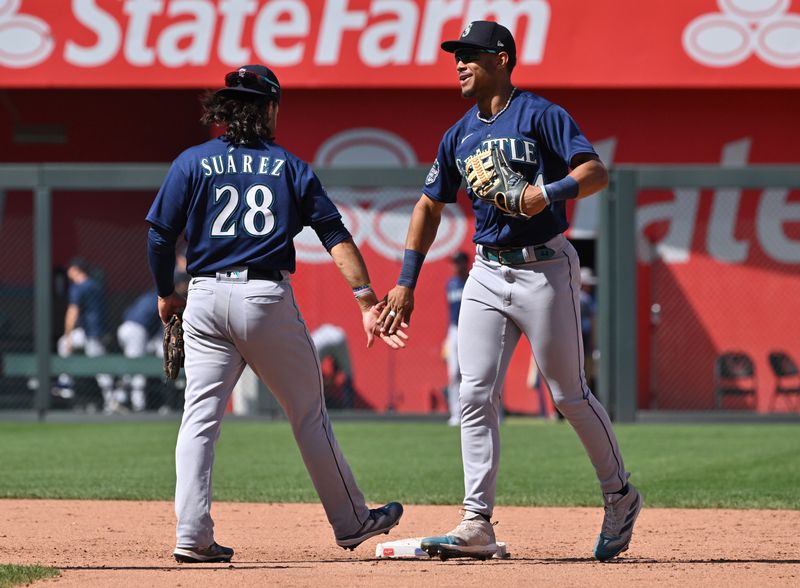 Aug 17, 2023; Kansas City, Missouri, USA;  Seattle Mariners center fielder Julio Rodriguez (44) celebrates with  Eugenio Suarez (28) after beating the Kansas City Royals at Kauffman Stadium. Mandatory Credit: Peter Aiken-USA TODAY Sports