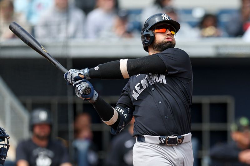 Mar 17, 2026; Port Charlotte, Florida, USA; New York Yankees catcher J.C. Escarra (25) hits a home run against the Tampa Bay Rays in the second inning during spring training at Charlotte Sports Park. Mandatory Credit: Nathan Ray Seebeck-Imagn Images