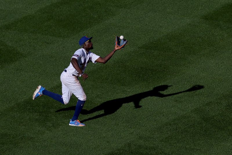 Oct 1, 2023; New York City, New York, USA; New York Mets second baseman Ronny Mauricio (10) catches a fly ball by Philadelphia Phillies right fielder Nick Castellanos (not pictured) during the fifth inning at Citi Field. Mandatory Credit: Brad Penner-USA TODAY Sports