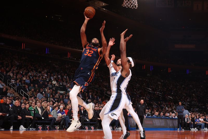 NEW YORK, NY - DECEMBER 3: Karl-Anthony Towns #32 of the New York Knicks drives to the basket during the game against the Orlando Magic during the Emirates NBA Cup on December 3, 2024 at Madison Square Garden in New York City, New York.  NOTE TO USER: User expressly acknowledges and agrees that, by downloading and or using this photograph, User is consenting to the terms and conditions of the Getty Images License Agreement. Mandatory Copyright Notice: Copyright 2024 NBAE  (Photo by Nathaniel S. Butler/NBAE via Getty Images)