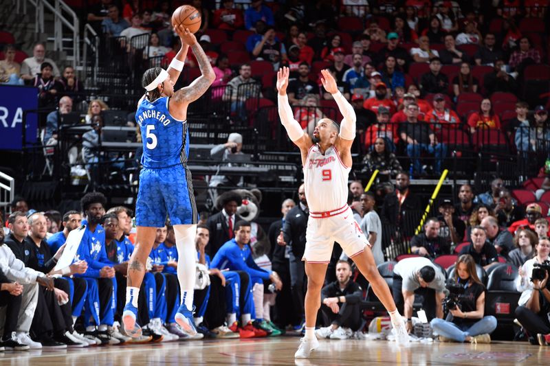 HOUSTON, TX - APRIL 9: Paolo Banchero #5 of the Orlando Magic shoots the ball during the game against the Houston Rockets on April 9, 2024 at the Toyota Center in Houston, Texas. NOTE TO USER: User expressly acknowledges and agrees that, by downloading and or using this photograph, User is consenting to the terms and conditions of the Getty Images License Agreement. Mandatory Copyright Notice: Copyright 2024 NBAE (Photo by Logan Riely/NBAE via Getty Images)