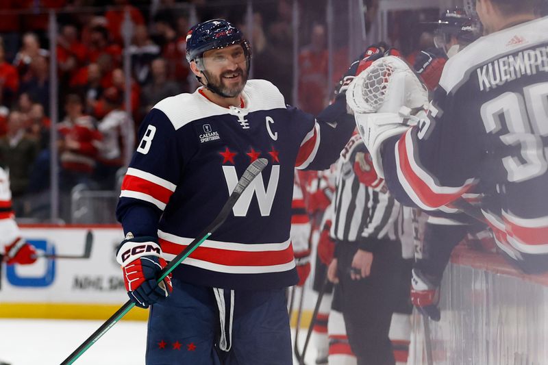 Feb 20, 2024; Washington, District of Columbia, USA; Washington Capitals left wing Alex Ovechkin (8) celebrates with teammates after scoring a goal against the New Jersey Devils in the third period at Capital One Arena. Mandatory Credit: Geoff Burke-USA TODAY Sports