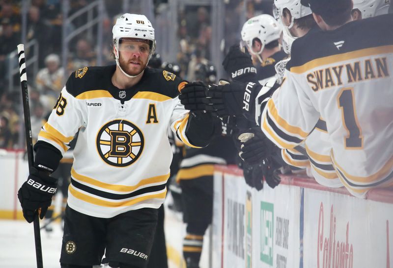 Mar 1, 2025; Pittsburgh, Pennsylvania, USA;  Boston Bruins right wing David Pastrnak (88) celebrates with the Bruins bench after scoring a goal against the Pittsburgh Penguins during the first period at PPG Paints Arena. Mandatory Credit: Charles LeClaire-Imagn Images