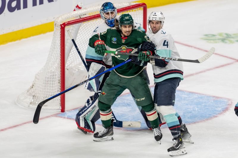 Apr 18, 2024; Saint Paul, Minnesota, USA; Minnesota Wild center Marat Khusnutdinov (22) screens Seattle Kraken goaltender Joey Daccord (35) as defenseman Justin Schultz (4) tries to move him out of the way in the second period at Xcel Energy Center. Mandatory Credit: Matt Blewett-USA TODAY Sports
