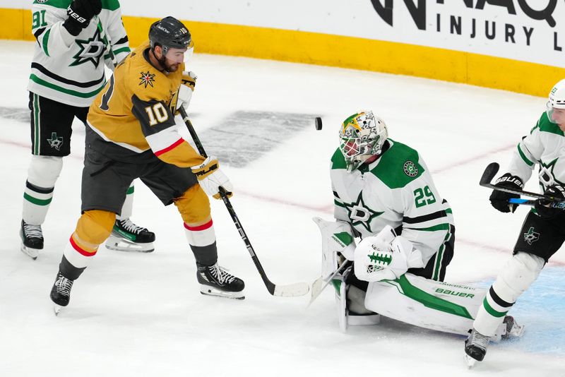 Apr 29, 2024; Las Vegas, Nevada, USA; Dallas Stars goaltender Jake Oettinger (29) makes a save as Vegas Golden Knights center Nicolas Roy (10) looks for the rebound during the third period of game four of the first round of the 2024 Stanley Cup Playoffs at T-Mobile Arena. Mandatory Credit: Stephen R. Sylvanie-USA TODAY Sports