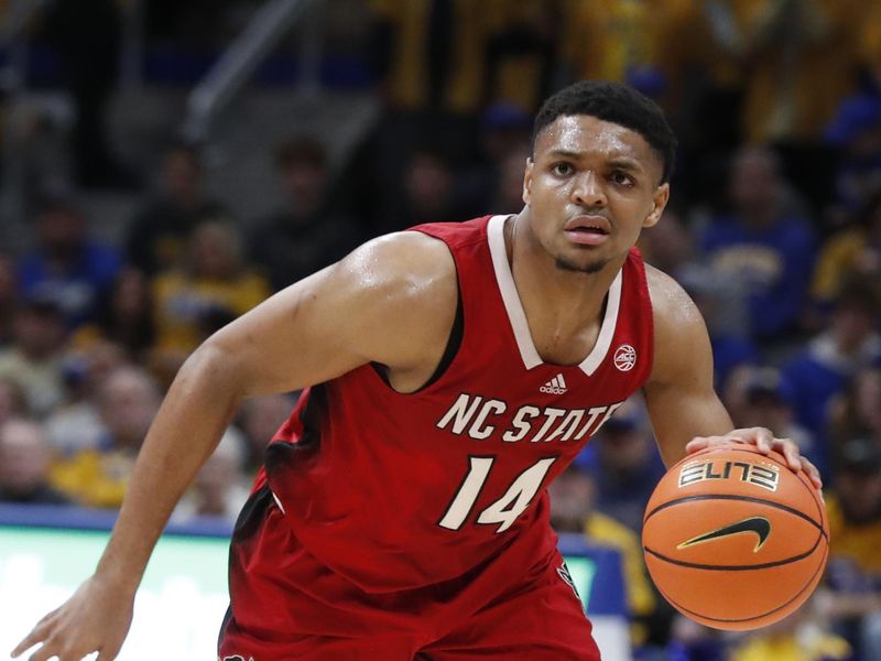 Mar 9, 2024; Pittsburgh, Pennsylvania, USA;  North Carolina State Wolfpack guard Casey Morsell (14) dribbles the ball during the first half at the Petersen Events Center. Mandatory Credit: Charles LeClaire-USA TODAY Sports