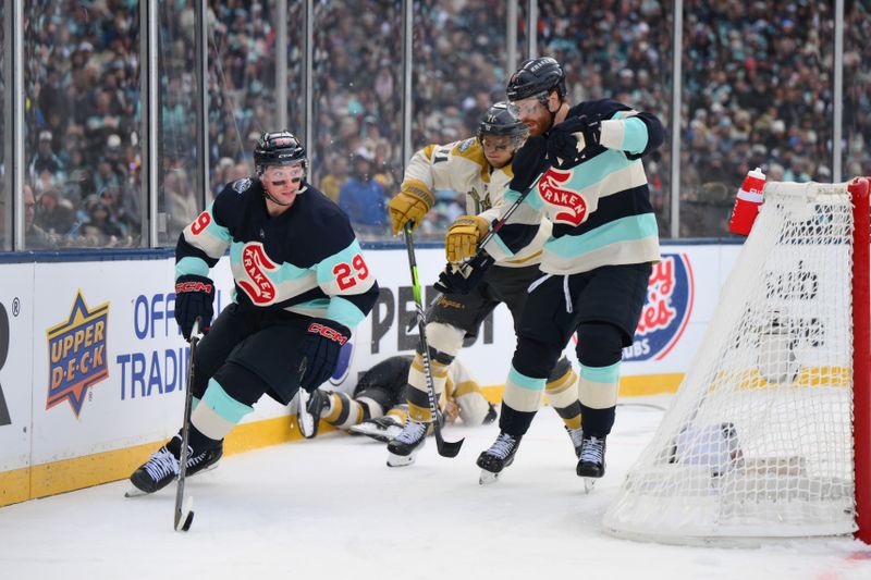 Jan 1, 2024; Seattle, Washington, USA; Seattle Kraken defenseman Vince Dunn (29) plays the puck against the Vegas Golden Knights during the 3rd period in the 2024 Winter Classic ice hockey game at T-Mobile Park. Mandatory Credit: Steven Bisig-USA TODAY Sports