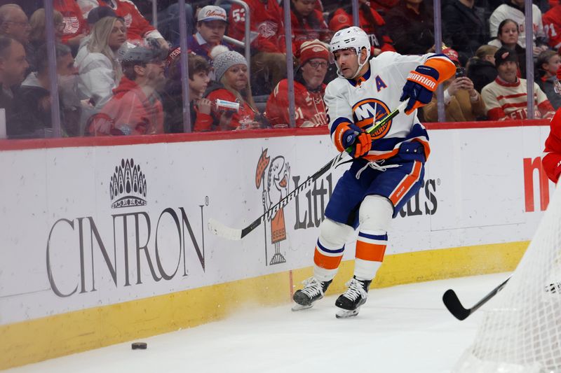 Feb 29, 2024; Detroit, Michigan, USA;  New York Islanders right wing Cal Clutterbuck (15) skates with the puck in the first period against the Detroit Red Wings at Little Caesars Arena. Mandatory Credit: Rick Osentoski-USA TODAY Sports