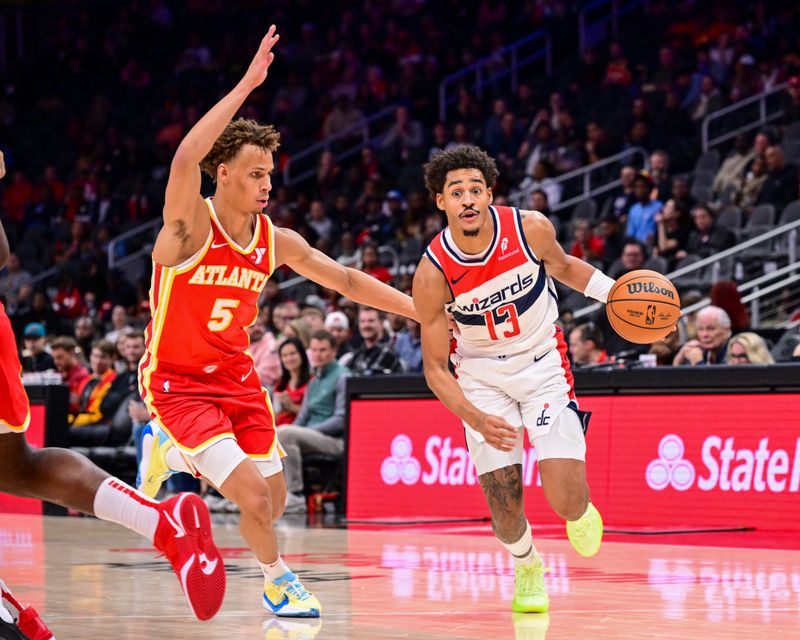 ATLANTA, GA - OCTOBER 28:  Jordan Poole #13 of the Washington Wizards drives to the basket during the game on October 28, 2024 at State Farm Arena in Atlanta, Georgia.  NOTE TO USER: User expressly acknowledges and agrees that, by downloading and/or using this Photograph, user is consenting to the terms and conditions of the Getty Images License Agreement. Mandatory Copyright Notice: Copyright 2024 NBAE (Photo by Adam Hagy/NBAE via Getty Images)