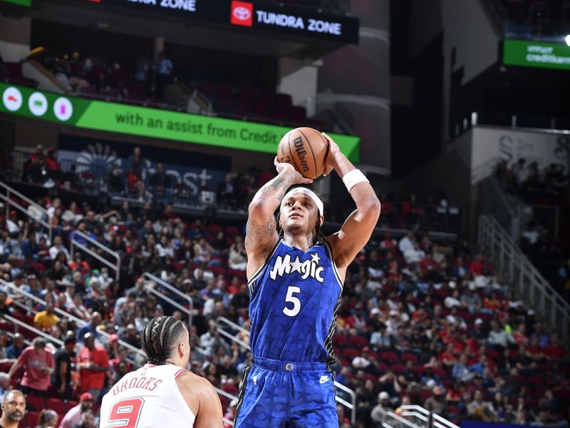 HOUSTON, TX - APRIL 9: Paolo Banchero #5 of the Orlando Magic shoots the ball during the game against the Houston Rockets on April 9, 2024 at the Toyota Center in Houston, Texas. NOTE TO USER: User expressly acknowledges and agrees that, by downloading and or using this photograph, User is consenting to the terms and conditions of the Getty Images License Agreement. Mandatory Copyright Notice: Copyright 2024 NBAE (Photo by Logan Riely/NBAE via Getty Images)