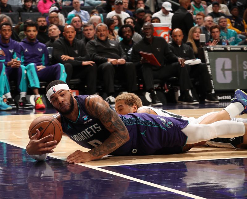 CHARLOTTE, NC - JANUARY 19: Miles Bridges #0 of the Charlotte Hornets reaches for the ball during the game against the San Antonio Spurs on January 19, 2024 at Spectrum Center in Charlotte, North Carolina. NOTE TO USER: User expressly acknowledges and agrees that, by downloading and or using this photograph, User is consenting to the terms and conditions of the Getty Images License Agreement. Mandatory Copyright Notice: Copyright 2024 NBAE (Photo by Kent Smith/NBAE via Getty Images)