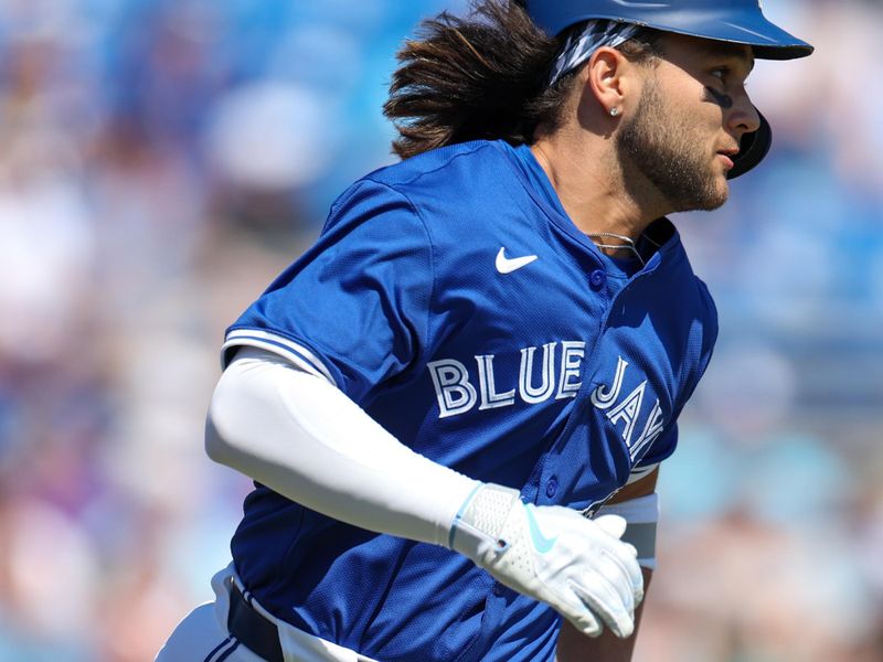 Feb 26, 2024; Dunedin, Florida, USA;  Toronto Blue Jays shortstop Bo Bichette (11) singles against the Pittsburgh Pirates in the first inning at TD Ballpark. Mandatory Credit: Nathan Ray Seebeck-USA TODAY Sports