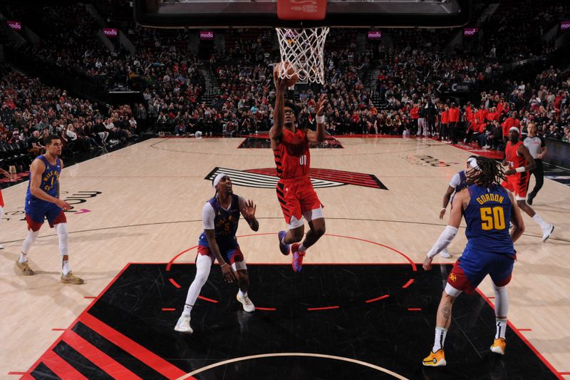 PORTLAND, OR - MARCH 23: Scoot Henderson #00 of the Portland Trail Blazers drives to the basket during the game against the Denver Nuggets on March 23, 2024 at the Moda Center Arena in Portland, Oregon. NOTE TO USER: User expressly acknowledges and agrees that, by downloading and or using this photograph, user is consenting to the terms and conditions of the Getty Images License Agreement. Mandatory Copyright Notice: Copyright 2024 NBAE (Photo by Cameron Browne/NBAE via Getty Images)