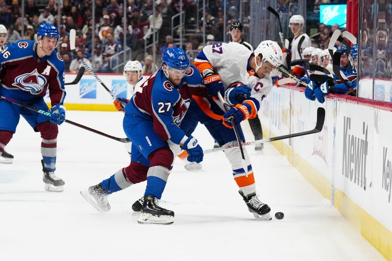 Jan 2, 2024; Denver, Colorado, USA; New York Islanders left wing Anders Lee (27) and Colorado Avalanche left wing Jonathan Drouin (27) battle for the puck in the first period at Ball Arena. Mandatory Credit: Ron Chenoy-USA TODAY Sports