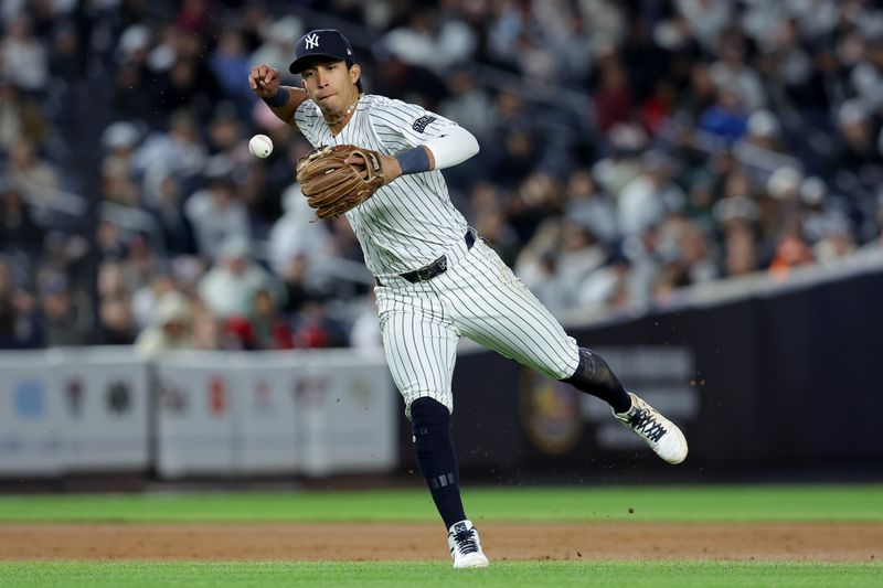 Apr 19, 2024; Bronx, New York, USA; New York Yankees third baseman Oswaldo Cabrera (95) bobbles a ground ball by Tampa Bay Rays designated hitter Harold Ramirez (not pictured) during the sixth inning at Yankee Stadium. Mandatory Credit: Brad Penner-USA TODAY Sports