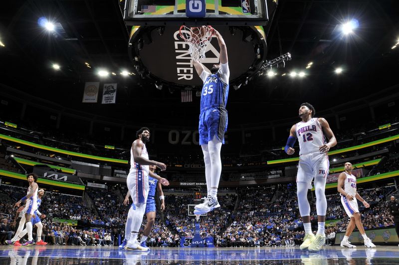 ORLANDO, FL - JANUARY 19: Goga Bitadze #35 of the Orlando Magic dunks the ball during the game against the Philadelphia 76ers on January 19, 2024 at the Kia Center in Orlando, Florida. NOTE TO USER: User expressly acknowledges and agrees that, by downloading and or using this photograph, User is consenting to the terms and conditions of the Getty Images License Agreement. Mandatory Copyright Notice: Copyright 2024 NBAE (Photo by Fernando Medina/NBAE via Getty Images)