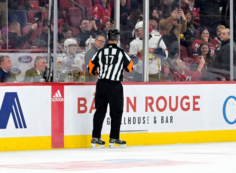 Apr 2, 2024; Montreal, Quebec, CAN; Referee Frederick L'Ecuyer (17) checks on the penalty box full to capacity with Florida Panthers players during the third period of the game against the Montreal Canadiens at the Bell Centre. Mandatory Credit: Eric Bolte-USA TODAY Sports