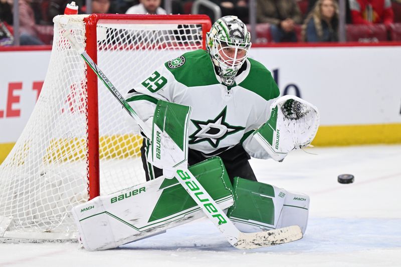 Jan 13, 2024; Chicago, Illinois, USA;  Dallas Stars goaltender Jake Oettinger (29) tracks a shot to make a save in the third period against the Chicago Blackhawks at United Center. Mandatory Credit: Jamie Sabau-USA TODAY Sports