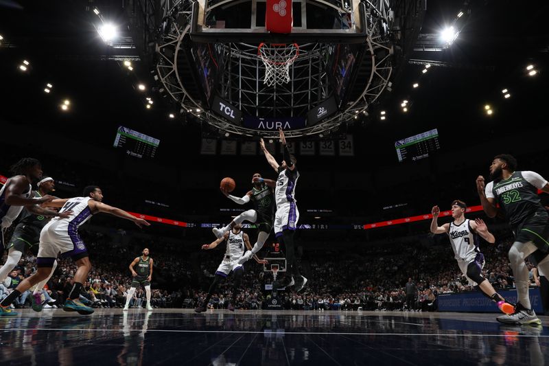 MINNEAPOLIS, MN -  MARCH 1: Mike Conley #10 of the Minnesota Timberwolves drives to the basket during the game against the Sacramento Kings on March 1, 2024 at Target Center in Minneapolis, Minnesota. NOTE TO USER: User expressly acknowledges and agrees that, by downloading and or using this Photograph, user is consenting to the terms and conditions of the Getty Images License Agreement. Mandatory Copyright Notice: Copyright 2024 NBAE (Photo by Jordan Johnson/NBAE via Getty Images)